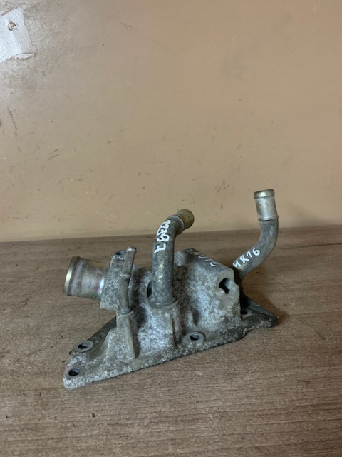 Nissan Note (E11) Корпус термостата Note (E11) 2006-2013 (11060BC20B)